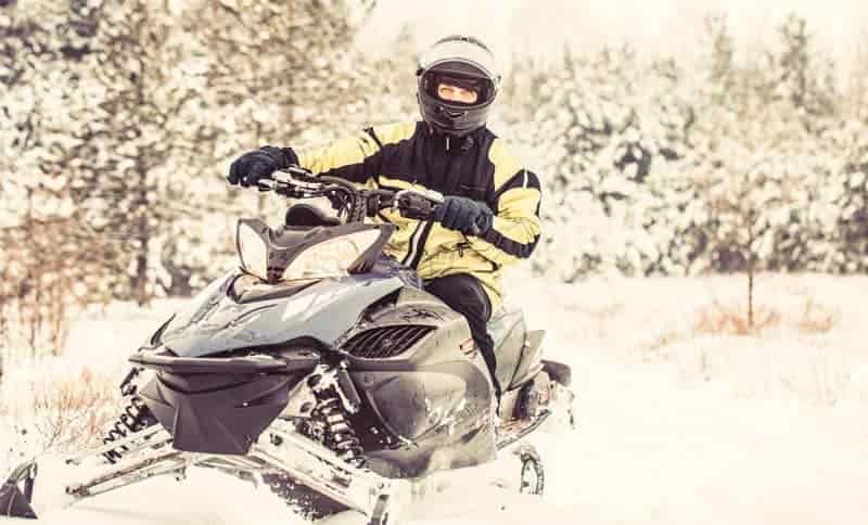 wrapped up in winter clothing snowmobile