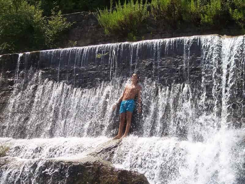 camping shower in waterfall
