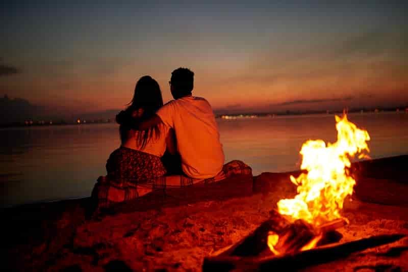romantic camping vacation campfire cuddle
